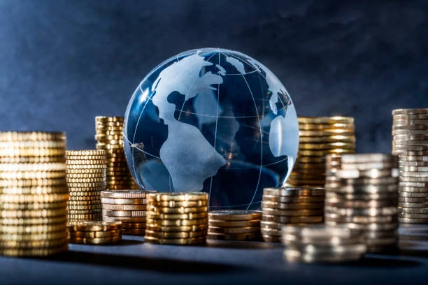 Global finance and economic growth concept with coins and globe